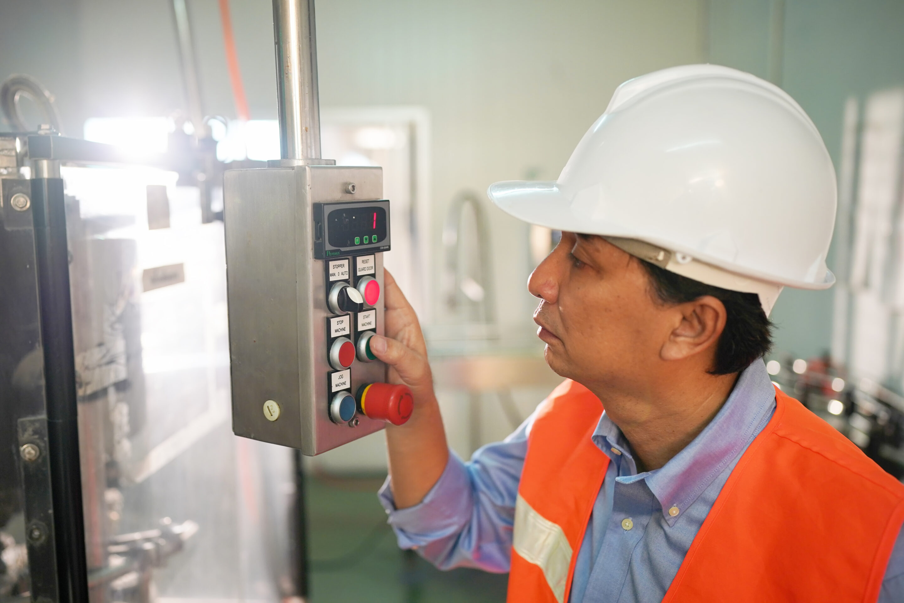 Manufacturing operator using digital control panel for real-time production data collection
